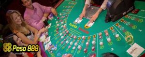 a group of people betting on baccarat table