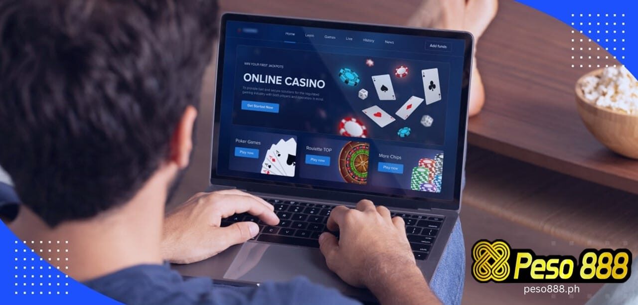 a man infront of computer that is showing a online casino website